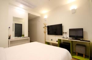 TV a/nebo společenská místnost v ubytování Bandal Hotel
