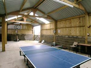 a large room with a ping pong table in it at The Old Barn in Commondale