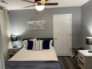 a bedroom with a bed and a ceiling fan at Downtown Home in Chattanooga in Chattanooga