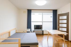 Televisyen dan/atau pusat hiburan di Furano Zone Ski Condo 202喫煙可103禁煙