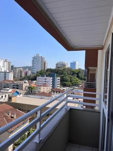 a balcony with a view of the city at Loft no centro de Joinville in Joinville