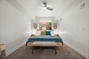 a bedroom with a bed and a ceiling fan at Urban Adventure Awaits Near Everything in Salt Lake City