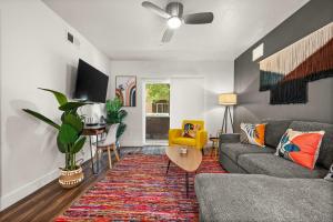 a living room with a couch and a table at Urban Adventure Awaits Near Everything in Salt Lake City