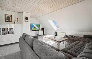 a living room with a couch and a table at Cozy Home In Egernsund With Wifi in Egernsund