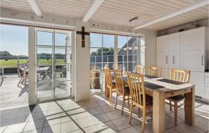 a kitchen and dining room with a table and chairs at Cozy Home In Egernsund With Wifi in Egernsund