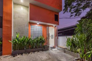 a house with plants in front of it at Victoria Villa Seminyak in Seminyak