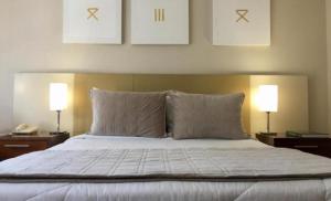 Кровать или кровати в номере Grand Plaza Paulista Hotel