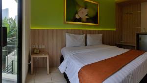 Postel nebo postele na pokoji v ubytování D'Bamboo Suites
