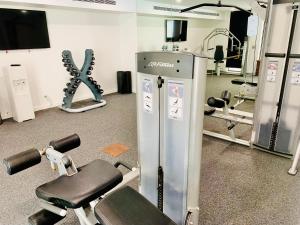 a fitness room with a gym with weights and machines at Lagoon Swimout Absolute Pool Front - Slice of Paradise - Sea Temple Pt Douglas in Port Douglas
