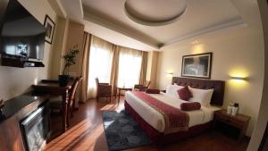 Postel nebo postele na pokoji v ubytování Crescent Resort, Darjeeling