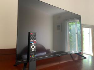 a flat screen tv sitting in a living room at Royal Hotel - Accommodation only in Parkes