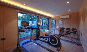 a room with a gym with a treadmill at Royale Sarovar Portico Agra in Agra