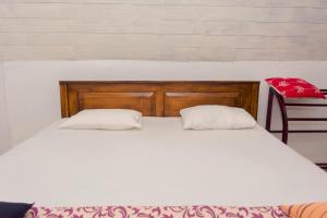 Postel nebo postele na pokoji v ubytování Harmony Beach Resort