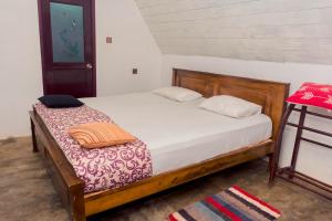 Postel nebo postele na pokoji v ubytování Harmony Beach Resort