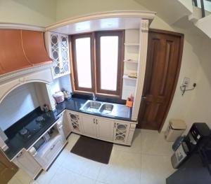 an overhead view of a kitchen with a sink at Villa Casa Baiti Syariah Malioboro in Jetis