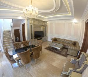an aerial view of a living room with a chandelier at Villa Casa Baiti Syariah Malioboro in Jetis