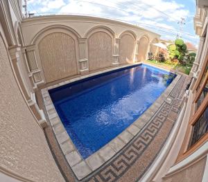 an overhead view of a swimming pool in a house at Villa Casa Baiti Syariah Malioboro in Jetis