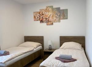Postelja oz. postelje v sobi nastanitve Apartmány MAX