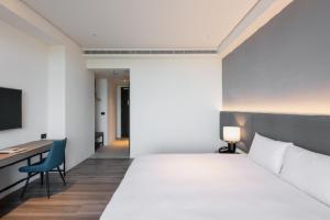 Una cama o camas en una habitación de Formosa Yacht Resort