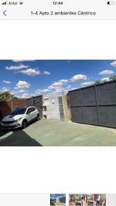 a picture of a car parked in a parking lot at N1-3 Apto Céntrico Pequeño Habitación C/ Aire Acondicionado P/4 Personas Baño Privado in Artigas +5 photos