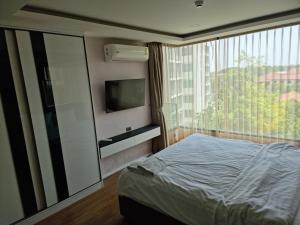 Postel nebo postele na pokoji v ubytování The Star Hill condo @ Chiang Mai