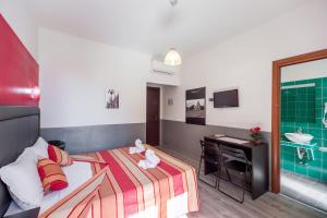 Postel nebo postele na pokoji v ubytování MF Hotel
