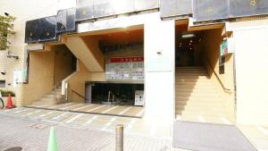 a store front of a building with stairs in front at Hotel Royal Oak Gotanda in Tokyo