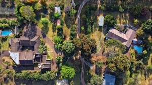 an aerial view of a house with trees at ilanda Guest House in White River