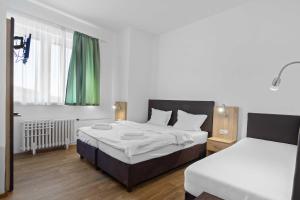 Postel nebo postele na pokoji v ubytování Hotel Červenohorské sedlo