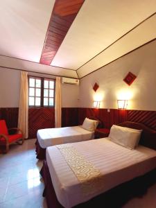 Кровать или кровати в номере Sepilok Jungle Resort
