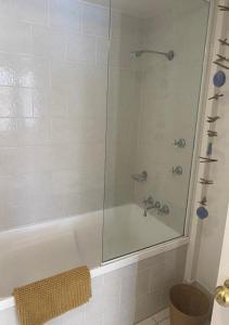 a shower with a glass door in a bathroom at Location Location Location - Broadbeach :) in Gold Coast