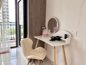 a white dressing table with a mirror and a chair at 1-2pax CozyStudio,Central Park Jb townCIQ, Free Netflix,Wi-Fi,Youtube in Johor Bahru