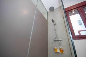 a shower in a bathroom with a glass door at Chueca Gran Via Recoletos Libertad 24 2 in Madrid