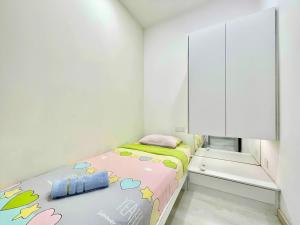מיטה או מיטות בחדר ב-Straits Garden Suites Penang