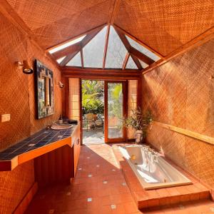 a large bathroom with a tub and a sink at Deerubbin Boat House in Dangar Island +25 photos