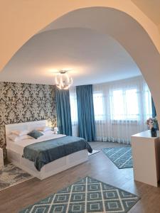 Ένα ή περισσότερα κρεβάτια σε δωμάτιο στο Maria City Apartament