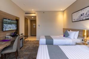 Postel nebo postele na pokoji v ubytování Anan Hotel by Snood