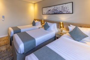 Postel nebo postele na pokoji v ubytování Anan Hotel by Snood
