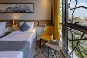 Postel nebo postele na pokoji v ubytování Anan Hotel by Snood