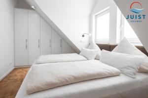 Postel nebo postele na pokoji v ubytování Haus Treibgut 236 - Wohnung 6