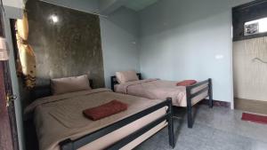 Katil atau katil-katil dalam bilik di Sabaidee Inn +9 gambar