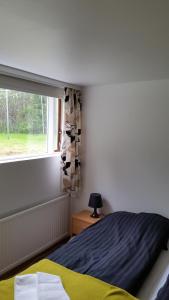 Postel nebo postele na pokoji v ubytování Lagarfell Studios