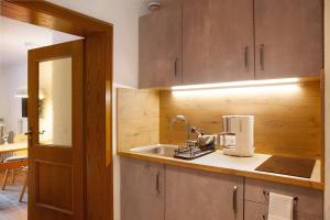 a kitchen with a sink and a counter top at Ferienwohnung Alpspitznest in Grainau