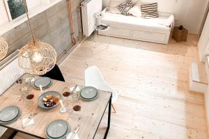 a dining room table with a plate of food on it at Pool-Loft-Wandern-Erholen-Sauna-Siebengebirge in Erpel