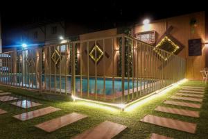 a swimming pool at night with lights around it at شقق منازل سوات للشقق المخدومة in Al Khobar