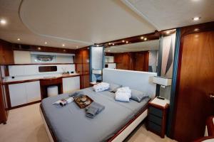 a large bedroom with a bed in a boat at Beyond82: Luxury Yacht in Puglia in Brindisi
