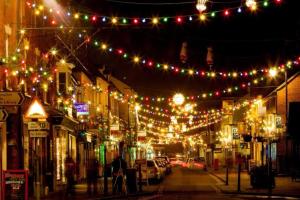 a city street at night with christmas lights at Stony Stratford Private Cosy Home in Stony Stratford