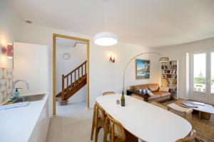 a living room with a table and a couch at Le Crayon - A 200m de la plage in Pléneuf-Val-André +13 photos