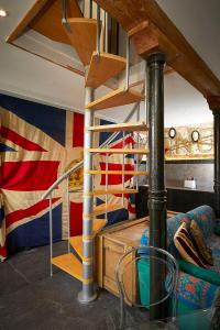 a room with a bunk bed and a staircase at Snobs and Rebels Apartments in Shaftesbury