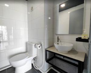 a white bathroom with a toilet and a sink at Spacious City Duplex 2 to 6pax, 1U-Ikea-Curve, Netflix in Petaling Jaya